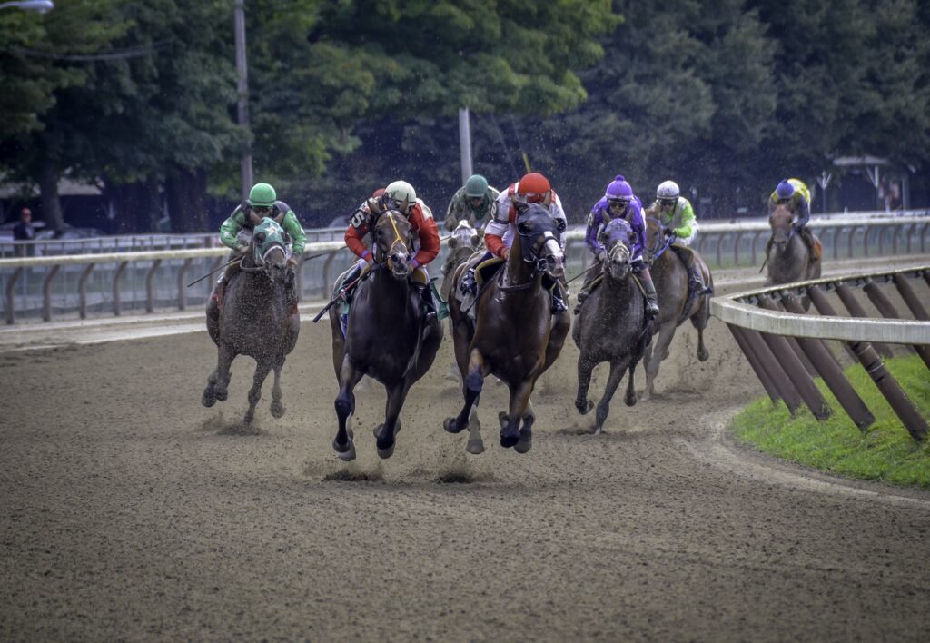 Horses racing with 8 hoofs off the ground